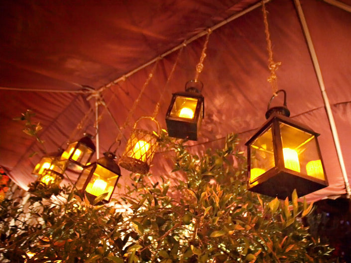 lanterns, candles, hanging light fixtures, best event designers