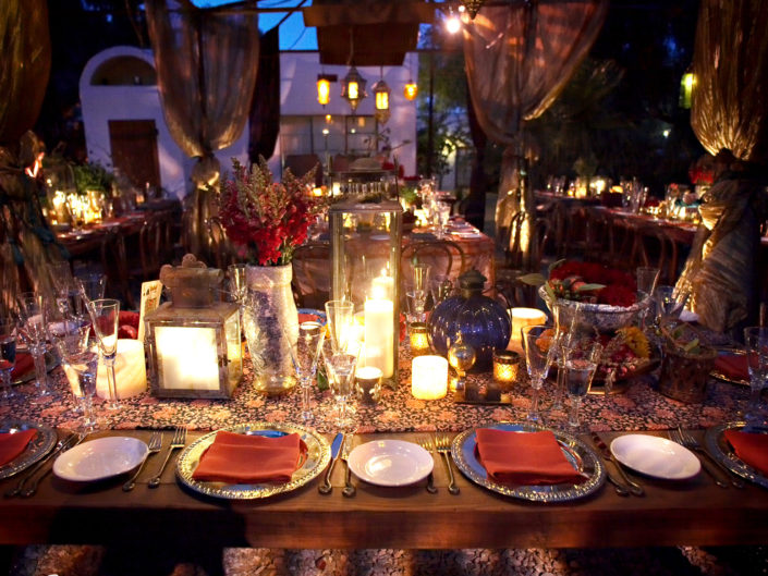 night, tablescape, moroccan theme, dinner, hanging lanterns, red accents, candles