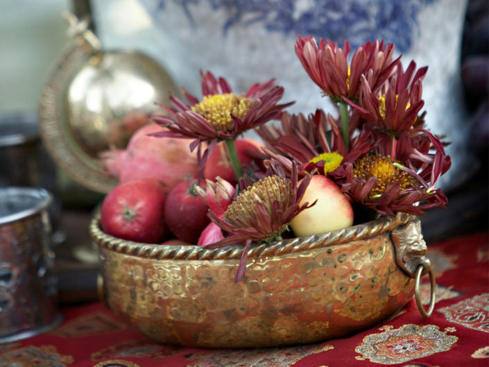 gold pot, floral arrangement, pomegranates, decorative bowl, la event planner