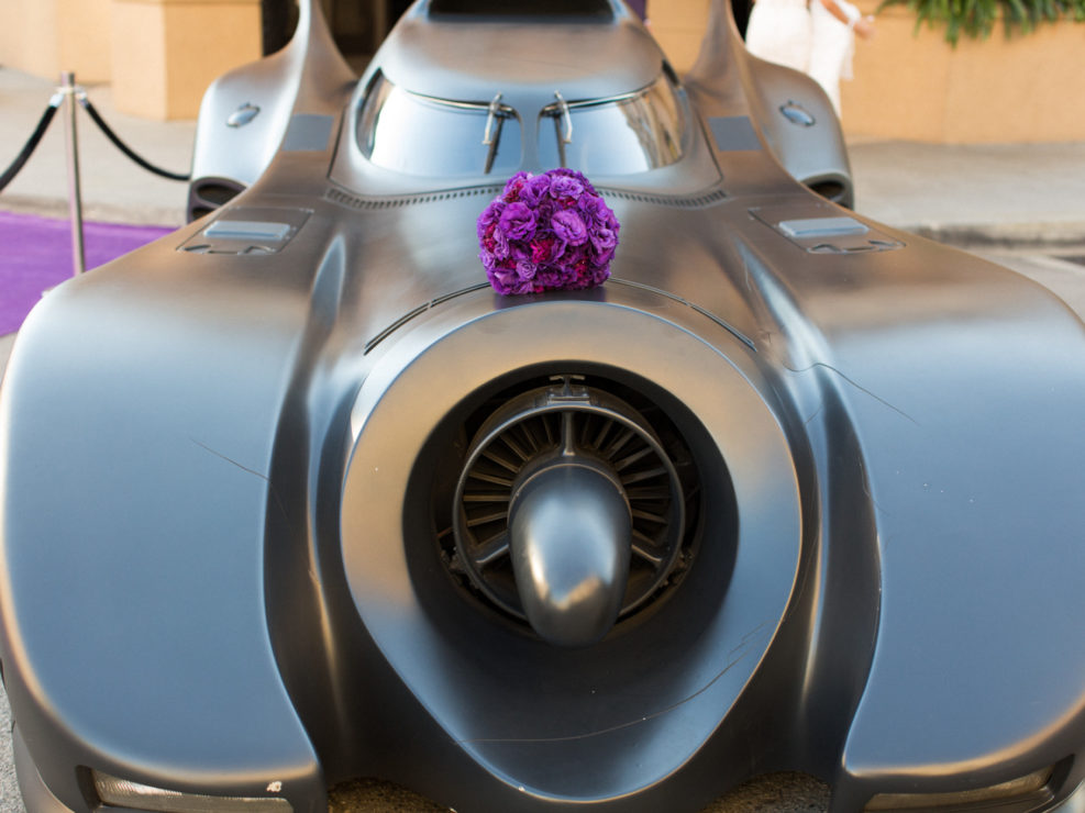 Wedding decor, bat mobile, purple floral bouquet, purple accents, purple carpet entrance, batman wedding, kristin banta, warner brothers studios, los angeles event planner