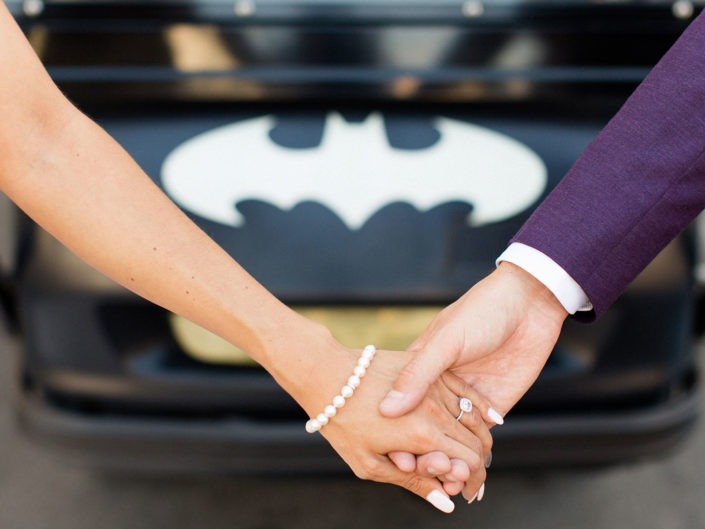 bride and groom holding hands, batman wedding, bat mobile, quirky and nerdy wedding, elegant wedding, happiness, kristin banta, los angeles event planner