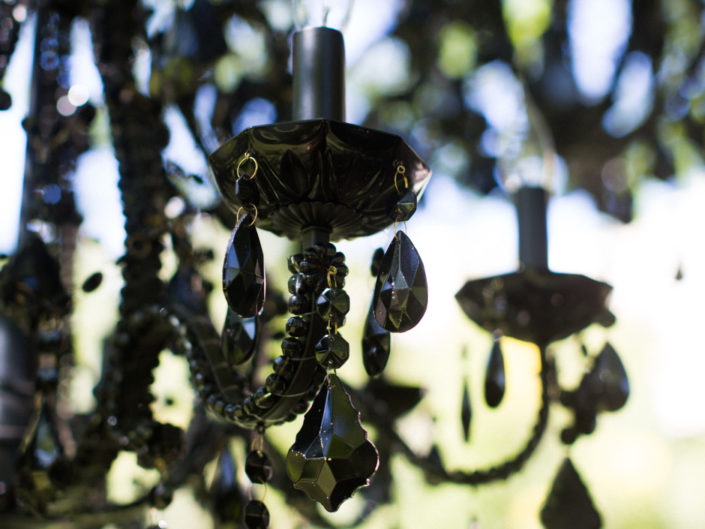 Black Chandeliers at a Garden wedding ceremony produced by Kristin Banta Events