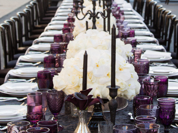 Crystal plum glassware, silver accents, black candles, wedding table top design, gothic wedding accents, steel candelabras for a Bruce Wayne themed wedding produced by Kristin Banta Events