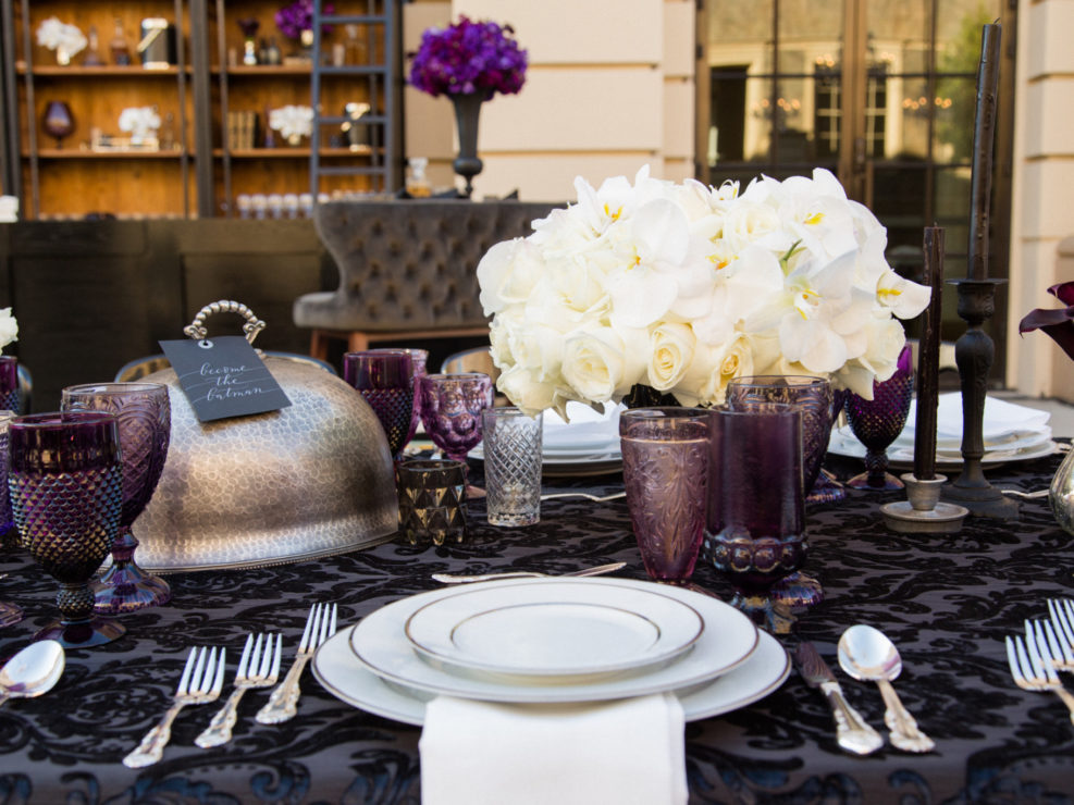 Crystal plum glassware, steel accents, white floral arrangements, gothic wedding accents, gothic wedding design for a Bruce Wayne Themed wedding produced by Kristin Banta Events