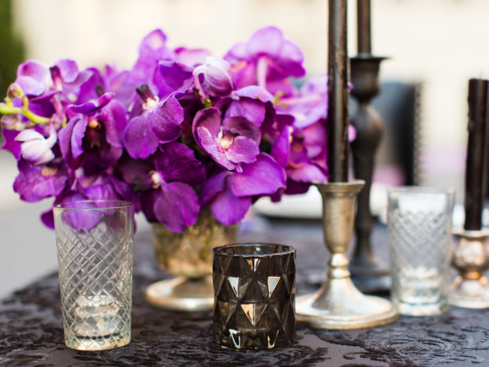dinning table top wedding decor, purple floral arrangements and accents, black candleabras, bruce wayne and batman inspired wedding, kristin banta los angeles event planner