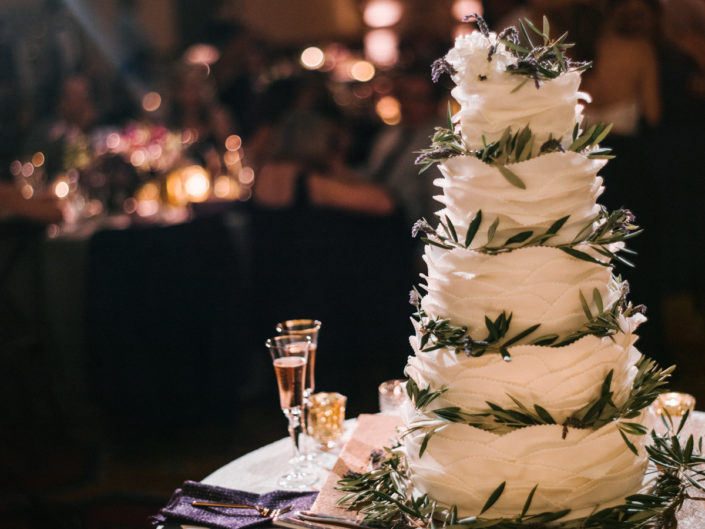 Wedding cake, greenery, olive branch and lavender accents, champagne flutes, Kristin Banta Weddings and Special Events