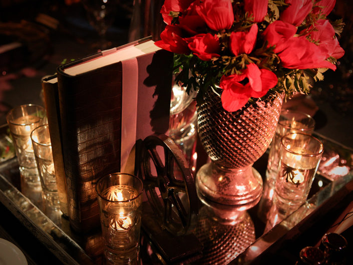 red flowers, books, wedding decor, candles, vintage decor, dark, gay wedding, la wedding designers,