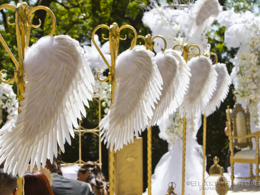 Angel wings, wedding aisle, wedding ceremony, feathers, gold accents, gold design, white wedding, floral arrangements, wedding design, wedding decor, cupid