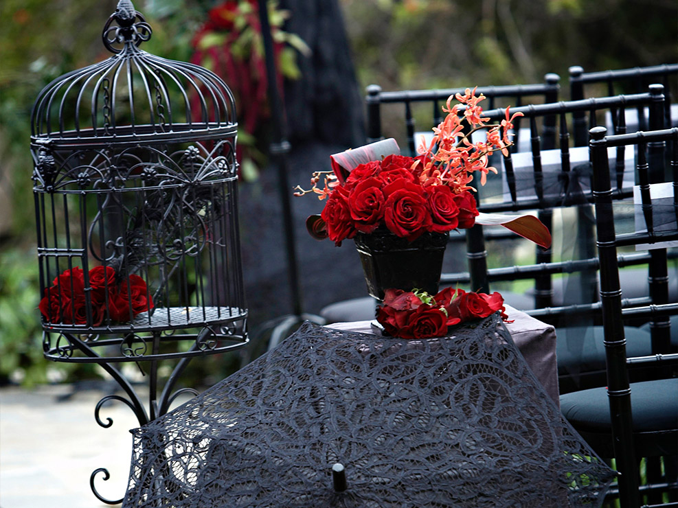 wedding decor, black lace umbrella, red roses, black versailles chair, bird cages, inspired decor, event planner in los angeles, weddings in LA, kristin banta events
