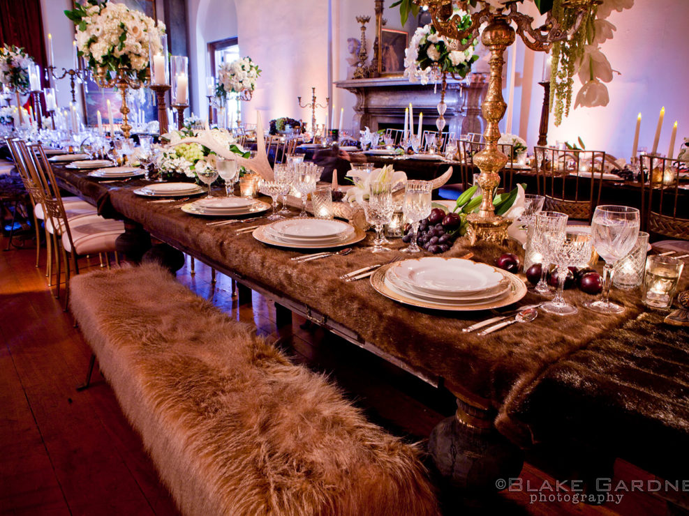 heaven and hell wedding theme, tablescape table top decor, fur tablescape, brass candelabras, white floral accents, kristin banta weddings and special events
