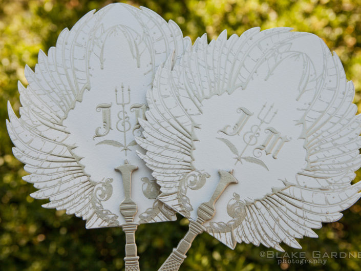 Ceremony, wedding ceremony, wedding design, wedding accents, initials, fans, wings, silver and white wedding accents, devil, feathers, feathered fan