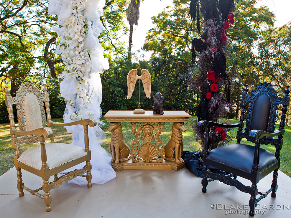 heaven and hell wedding altar, gates to heaven and hell, gold and black accent, red and white florals, gay wedding, kristin banta weddings and special events