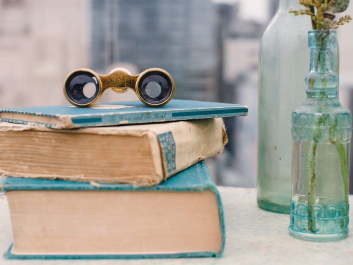 books, teal, binoculars, la event planners