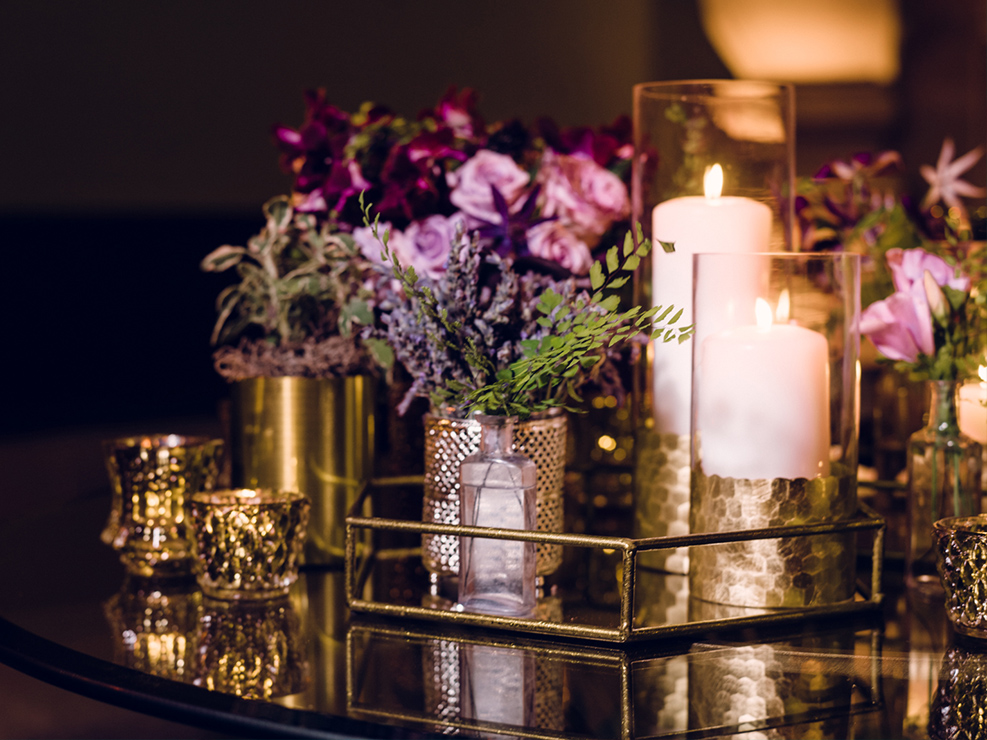 lavender and dark purple floral accents and arrangements, greenery accents, honeycomb candles, bar decor, table top decor, los angeles wedding and event planner
