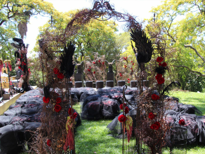 hell wedding side, black red and crimson floral and color accents, black angel wings, heaven and hell wedding decor, outdoor wedding, hell gates, kristin banta weddings and special events