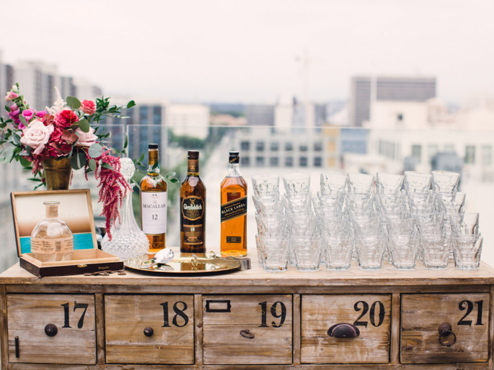 number bar, vintage bar, alcohol, whiskey, tequila, liquor, crystal glassware, floral arrangement, distressed wood, distressed wood furniture, event decor, decorations, vintage decorations, party decorations, LA rooftop, Perch LA, Perch rooftop, rooftop event