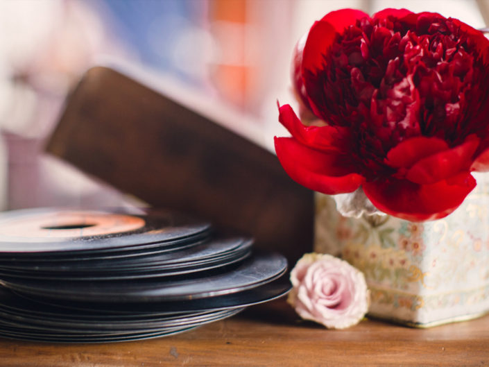 records, Antique camera, floral arrangement, crystal glassware, gold chargers, antique decor, antique design, luncheon, birthday celebration, birthday decor, birthday design, tablescape, table design, crystal glassware, gold chargers, event decor, antique books, flower vase