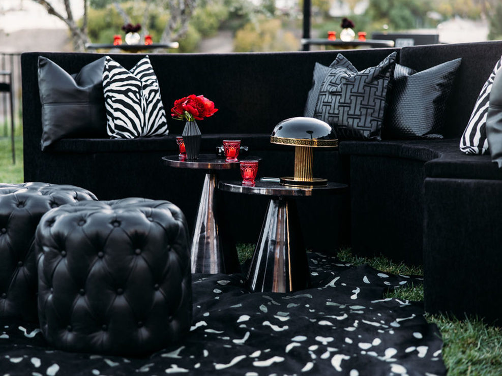Black Lounge Area, Round Tables, Ottoman, Zebra Pillows